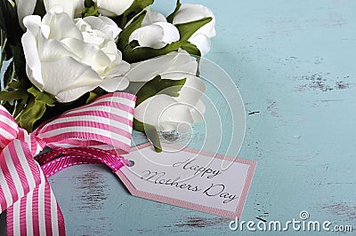 Happy Mothers Day gift of white roses bouquet with copy space