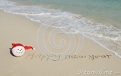 Happy new year message on the sand