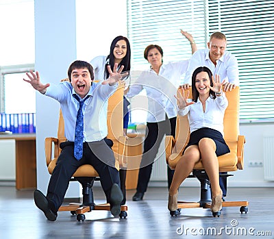 Happy office employees having fun at work