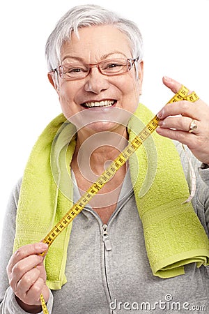 Happy old lady with tape measure