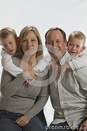 Happy parents with 6 years old identical twins