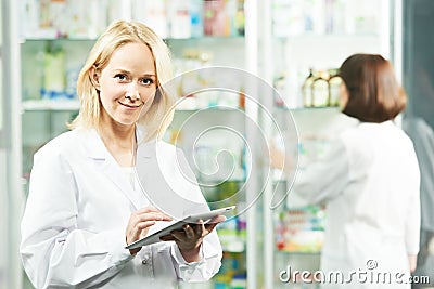 Happy Pharmacy chemist woman in drugstore