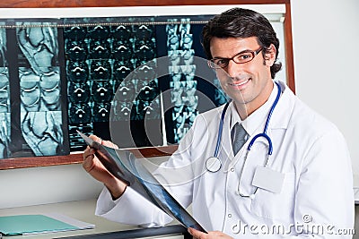 Happy Radiologist Holding X-ray