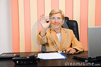 Happy senior businesswoman showing okay sign hand