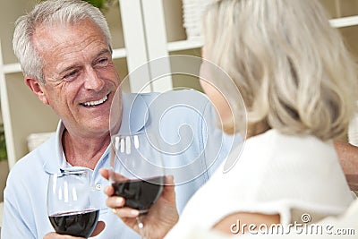 Happy Senior Couple Drinking Wine at Home