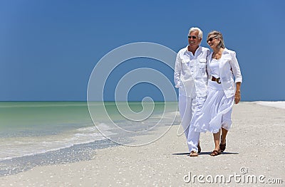 Happy Senior Couple Walking on A Tropical Beach