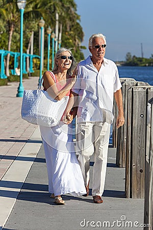 Happy Senior Couple Walking Tropical Sea or River