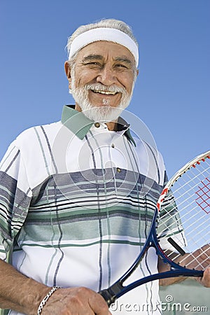 Happy Senior Man Holding Tennis Racket