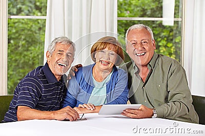Happy senior people with tablet