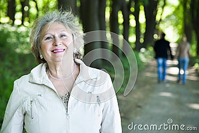 Happy senior woman and walking couple