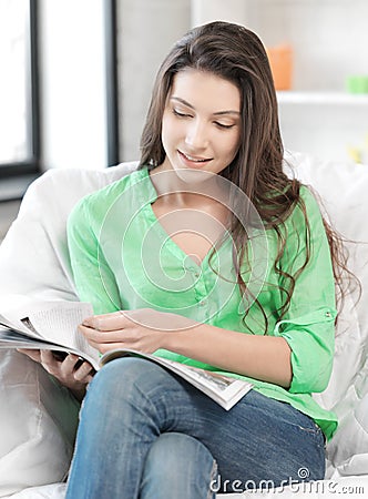 Happy and smiling woman with magazine