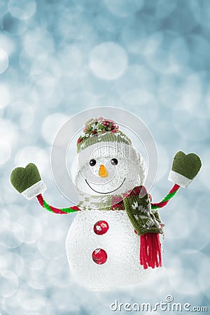 Happy snowman with lights in the background
