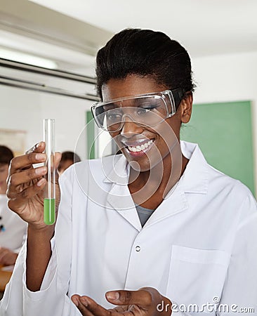 Happy Teacher Looking At Chemical Solution