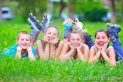 Happy teenage friends having fun in spring park