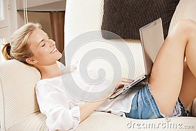 Happy teenage girl with laptop computer