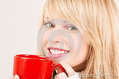 Happy teenage girl with red mug