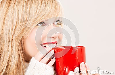 Happy teenage girl with red mug