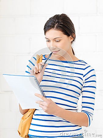 Happy woman with big notepad