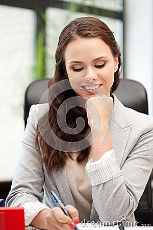 Happy woman with big notepad