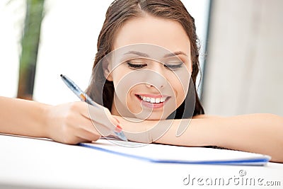 Happy woman with big notepad