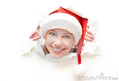 Face+in+Hole+Christmas Face of happy woman with christmas hat peeking through a hole torn in ...
