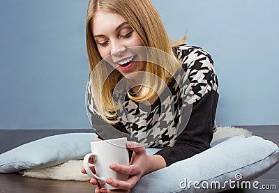 Happy woman with cup of coffee