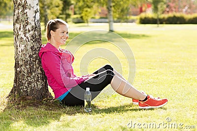 Happy woman jogger training in the park. Healthy lifestyle and p