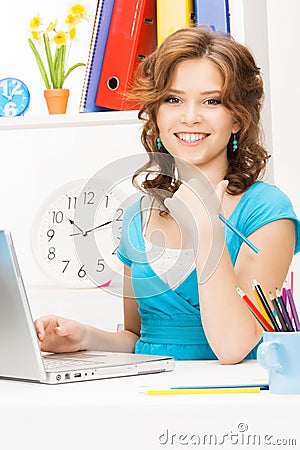 Happy woman with laptop computer