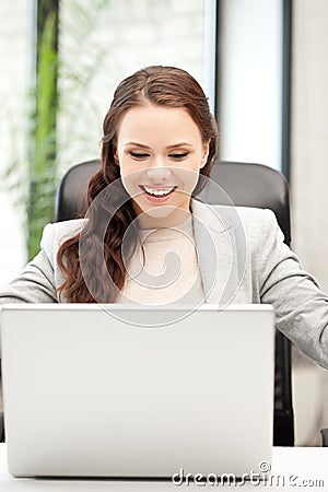 Happy woman with laptop computer