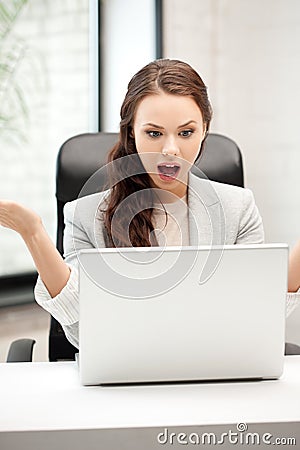 Happy woman with laptop computer