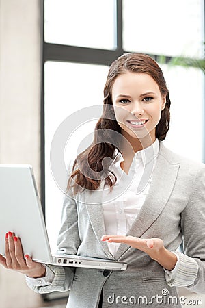 Happy woman with laptop computer