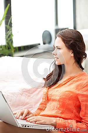 Happy woman with laptop computer