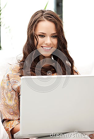 Happy woman with laptop computer