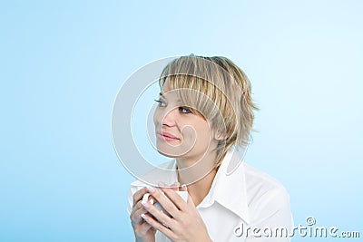 A happy woman at morning with a cup of coffee