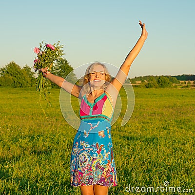 Happy woman on nature with flowers
