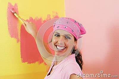 Happy Woman Painting Pink and Yellow