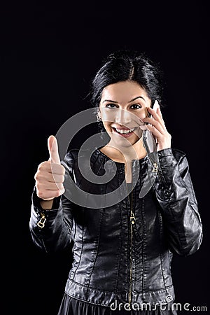 Happy woman speaks on the phone