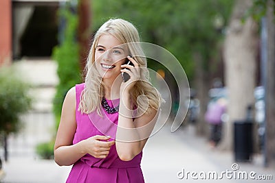 Happy Woman Talking on Mobile Phone