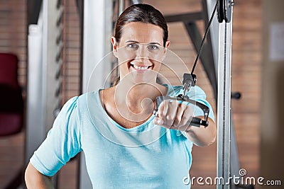 Happy Woman Working Out In Health Club