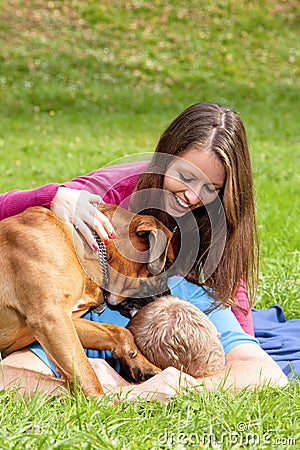 Happy Young Couple with Dog