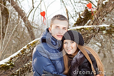 Happy Young Couple in Winter garden