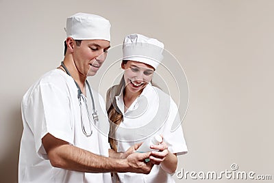 Happy young doctor and a nurse at the hospital
