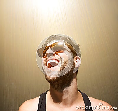 Happy young man smiling with sunglasses