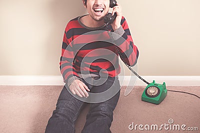 Happy young man on the telephone