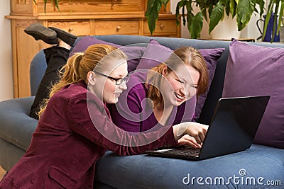 Happy young women with laptop
