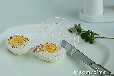 Hard boiled eggs sliced halves isolated white background