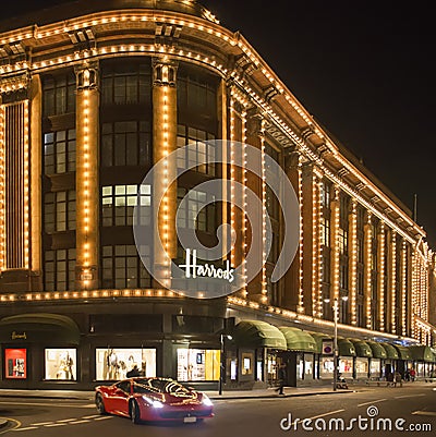 Harrods department store. Ferrari passes in front of the buildin