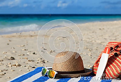 Hat, bag, sun glasses on tropical beach