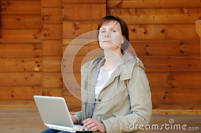Haughty woman with laptop