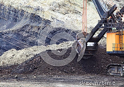 Haul Trucks being loaded with ore.